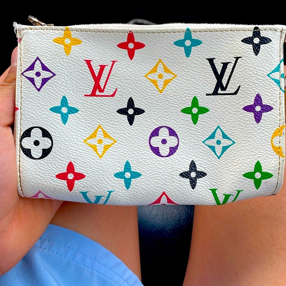 Louis Vuitton white multicolor purse, used and has a little stain